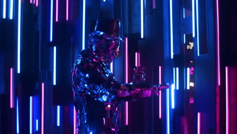 The-camera-follows-the-Mesmerizing-dancing-of-a-glittering-robot-man-on-a-neon-wall.